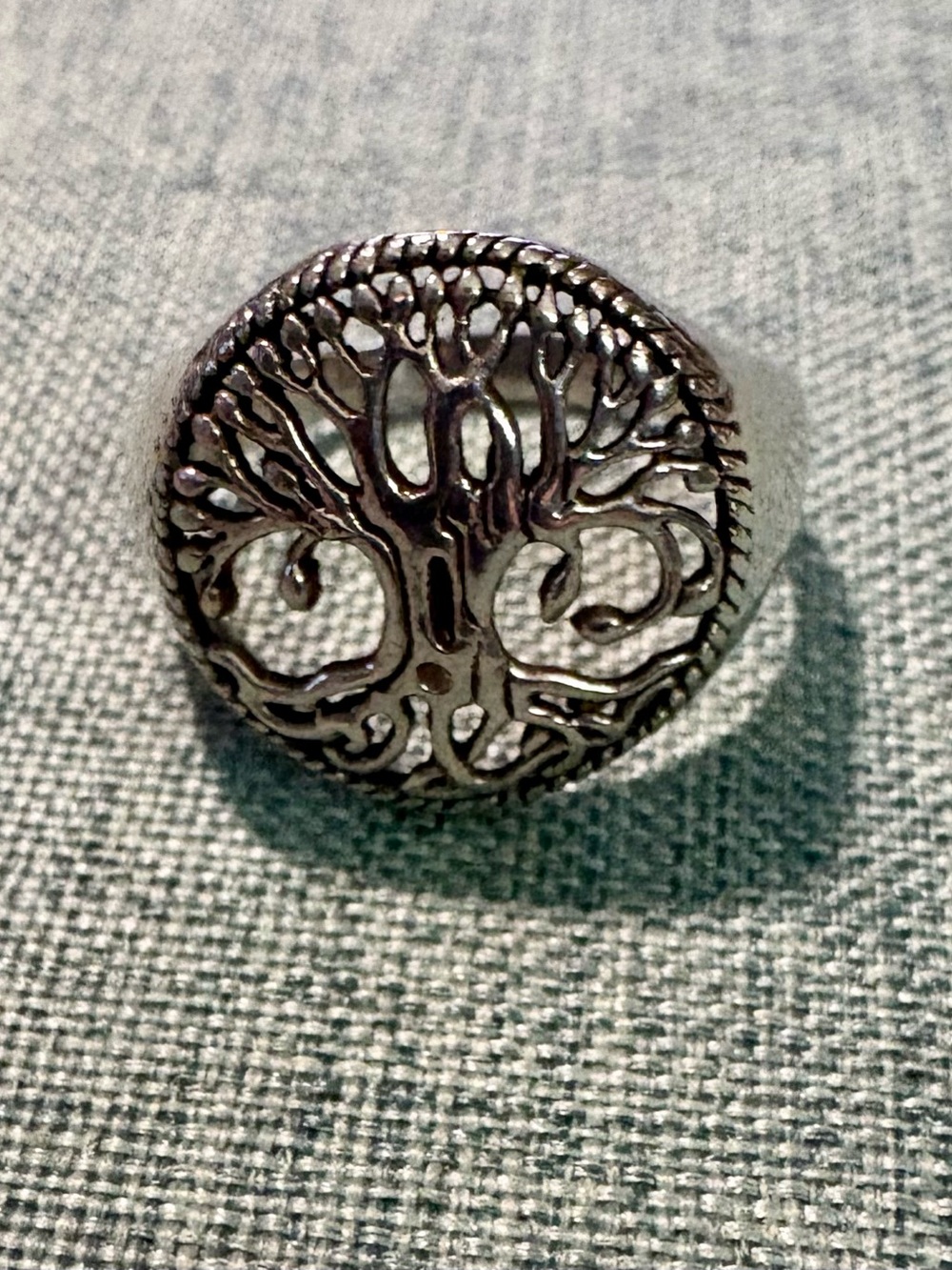 Tree of Life ring featuring an intricate cut-out circular filigree design 925